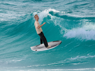 Adam goes surfing